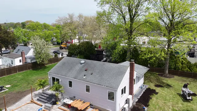 Aerial of the finished backyard, shed and lawn from a higher angle.